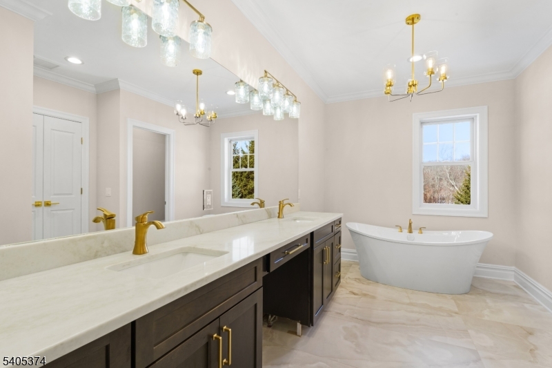 502 Tiffany Way Watchung, NJ 07069 - Photo 23 of 41 a bathroom with a tub sink and a mirror