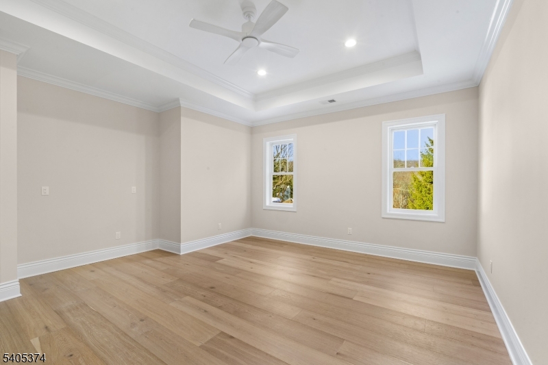 502 Tiffany Way Watchung, NJ 07069 - Photo 28 of 41 an empty room with wooden floor and windows