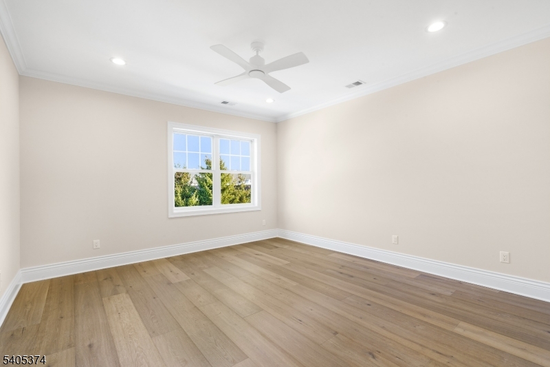 502 Tiffany Way Watchung, NJ 07069 - Photo 30 of 41 an empty room with wooden floor and windows