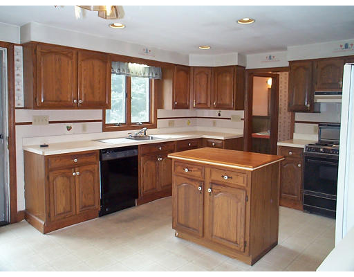 44 Concord Road Billerica, MA 01821 - Photo 2 of 12 a kitchen with a sink stove top oven and cabinets