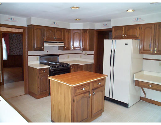44 Concord Road Billerica, MA 01821 - Photo 4 of 12 a kitchen with stainless steel appliances a refrigerator a stove a sink and a refrigerator