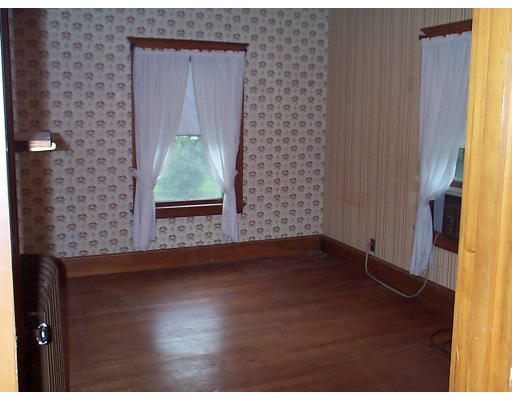 44 Concord Road Billerica, MA 01821 - Photo 10 of 12 a view of a hallway with wooden floor and a window