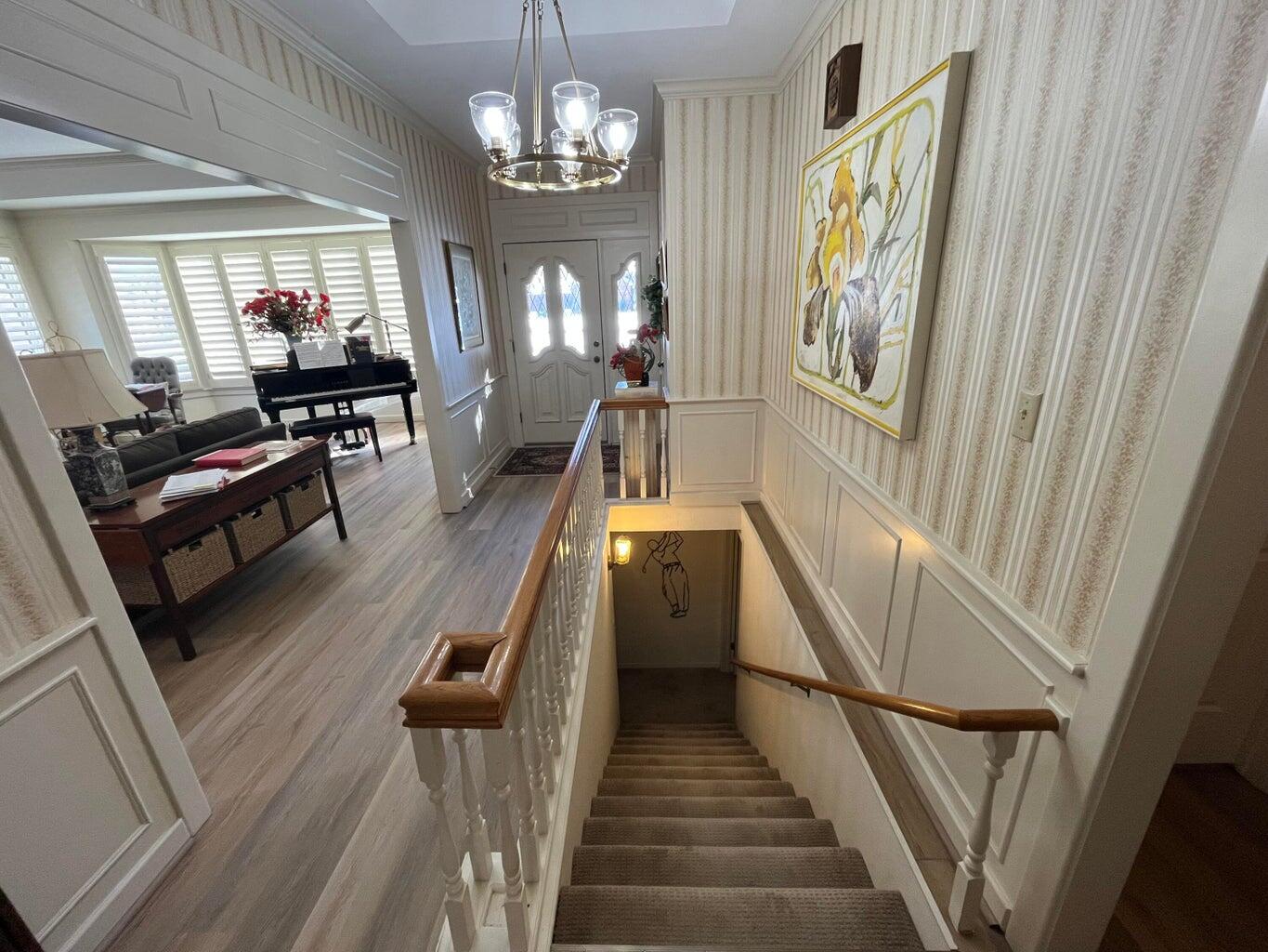 8 Westridge Square Plainview, TX 79072 - Photo 11 of 41 a view of a livingroom with furniture stairs wooden floor and windows