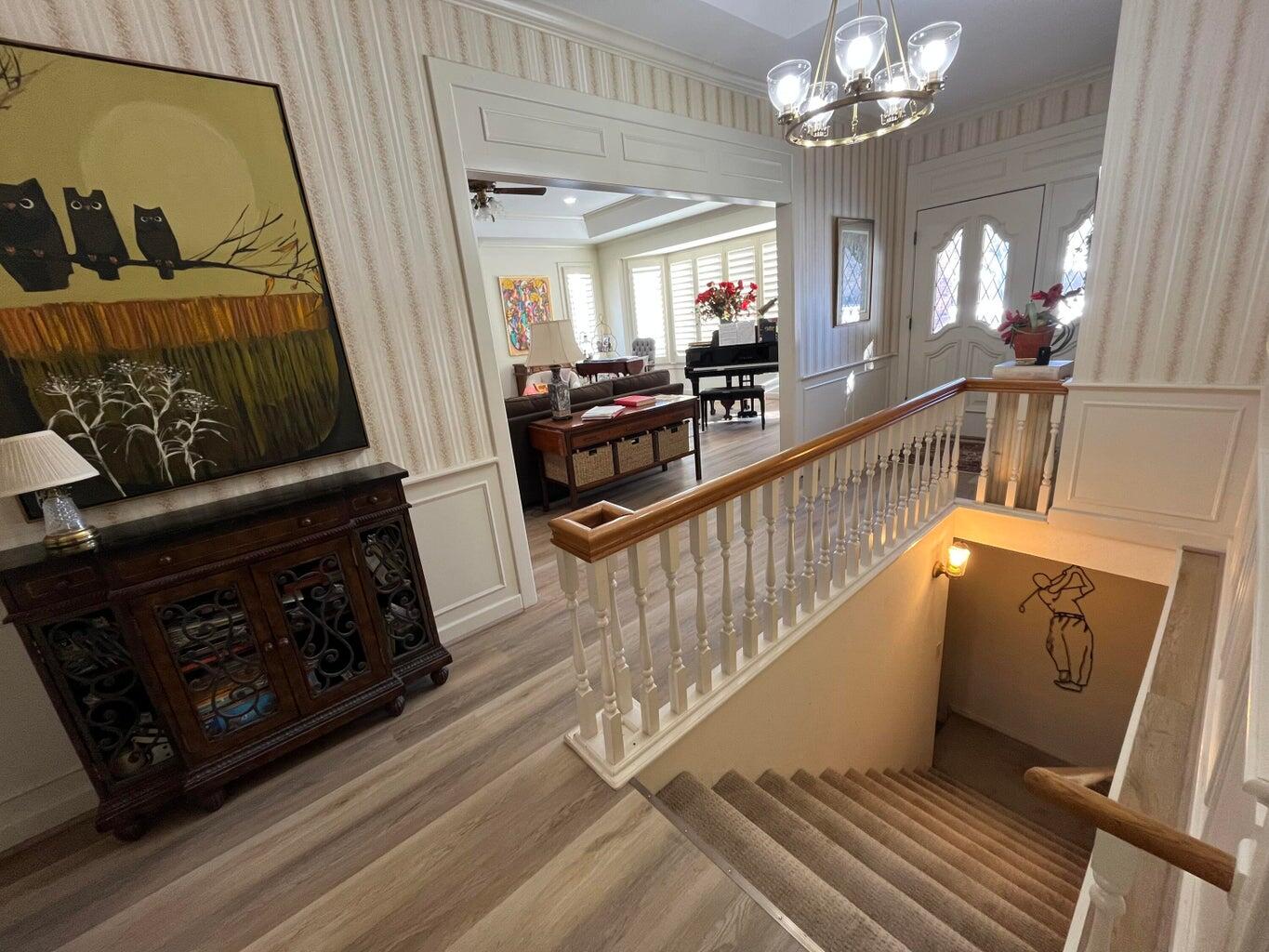 8 Westridge Square Plainview, TX 79072 - Photo 12 of 41 a view of a hallway with wooden floor and staircase