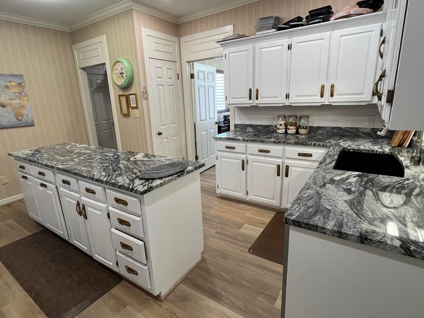 8 Westridge Square Plainview, TX 79072 - Photo 18 of 41 a kitchen with stainless steel appliances granite countertop a stove and a sink