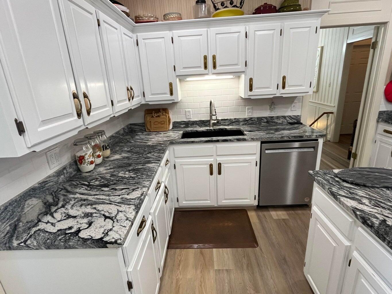 8 Westridge Square Plainview, TX 79072 - Photo 20 of 41 a kitchen with a stove a sink and a refrigerator