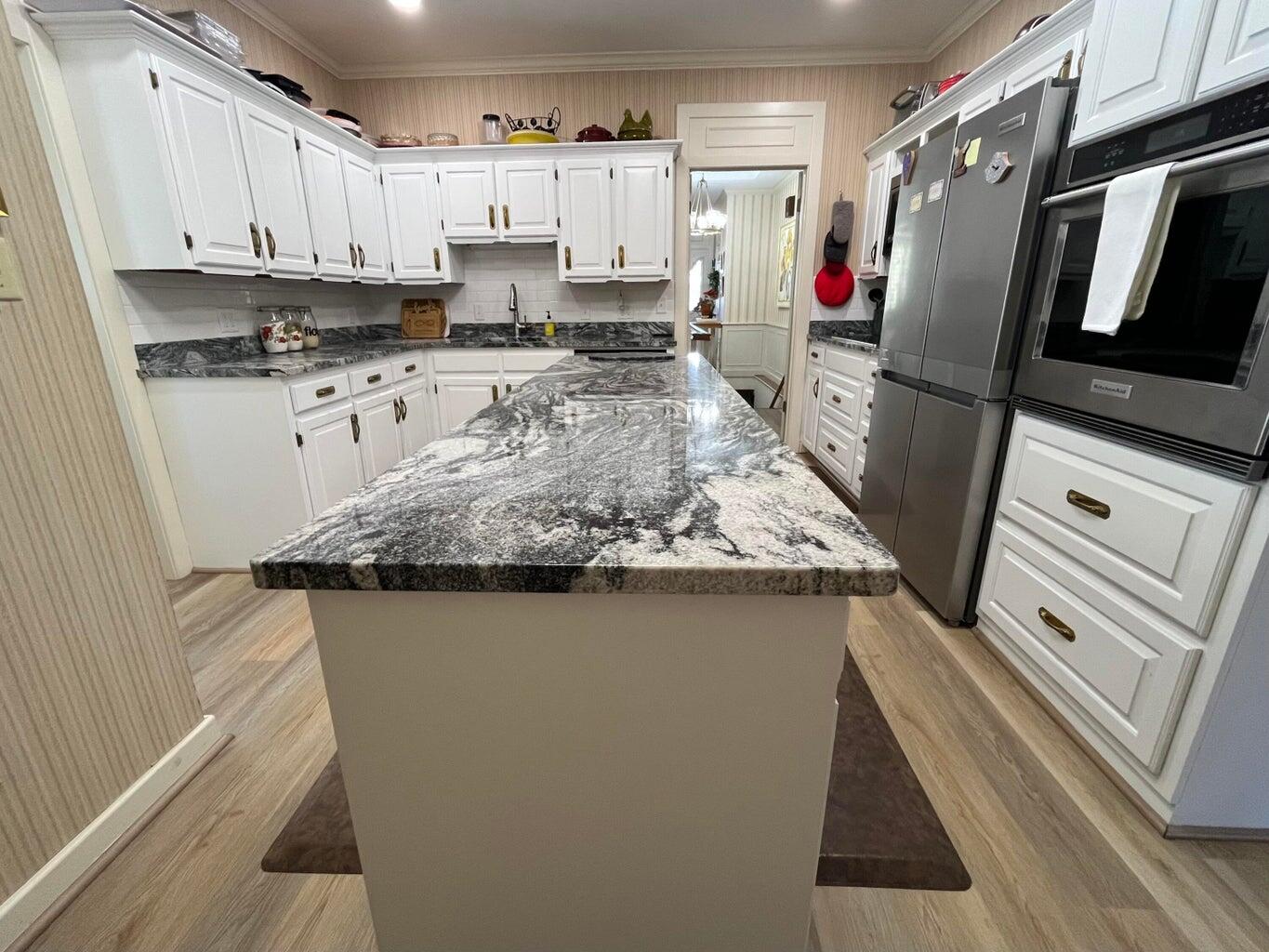8 Westridge Square Plainview, TX 79072 - Photo 23 of 41 a kitchen with stainless steel appliances granite countertop a sink stove and refrigerator