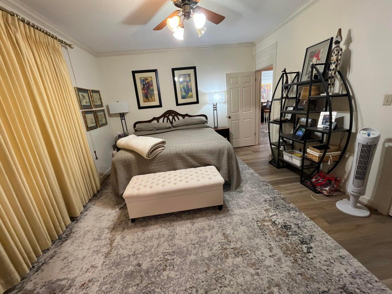 8 Westridge Square Plainview, TX 79072 - Photo 27 of 41 a spacious bedroom with a bed and a large mirror on the dresser