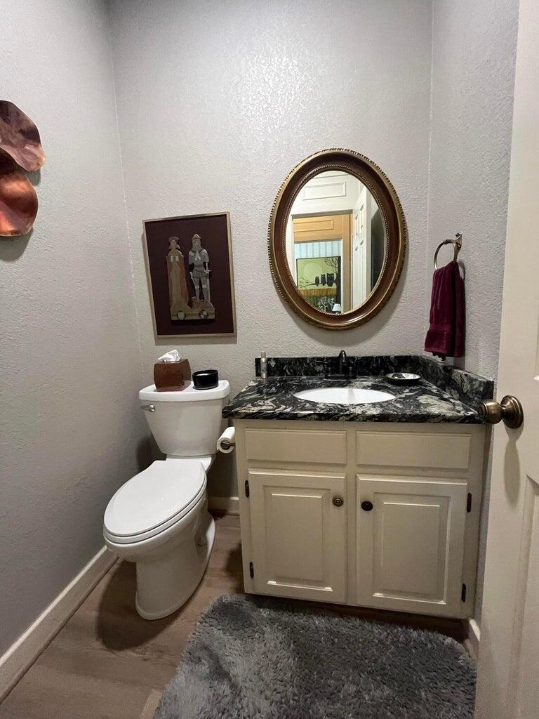 8 Westridge Square Plainview, TX 79072 - Photo 40 of 41 a bathroom with a toilet a sink and a mirror
