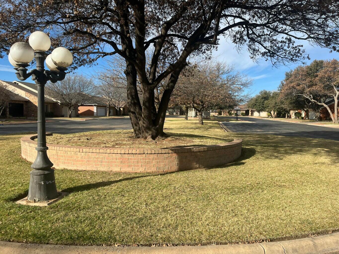 8 Westridge Square Plainview, TX 79072 - Photo 9 of 41 a front view of a house with swimming pool
