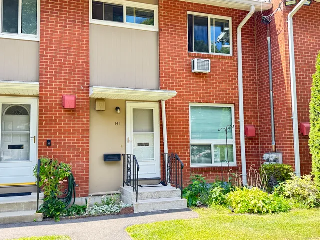 a front view of a house having yard