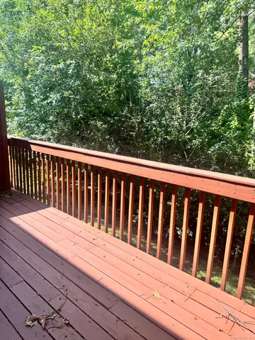 a balcony with wooden floor