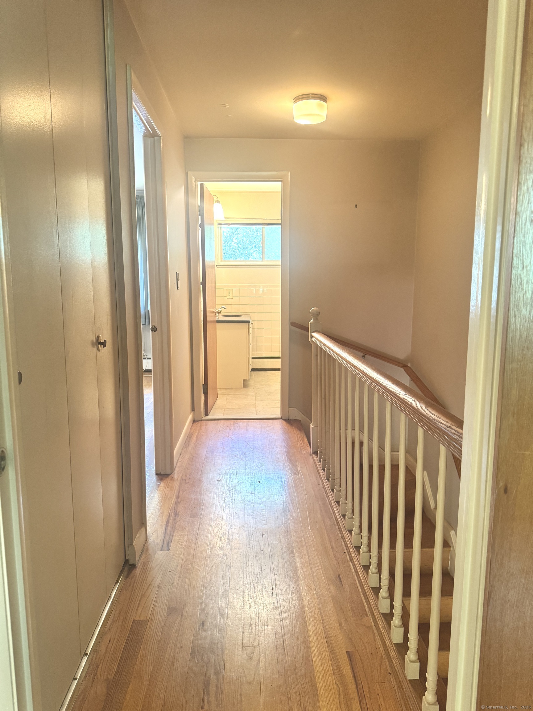 141 Worth Avenue Hamden, CT 06518 - Photo 8 of 17 a view of a hallway with wooden floor