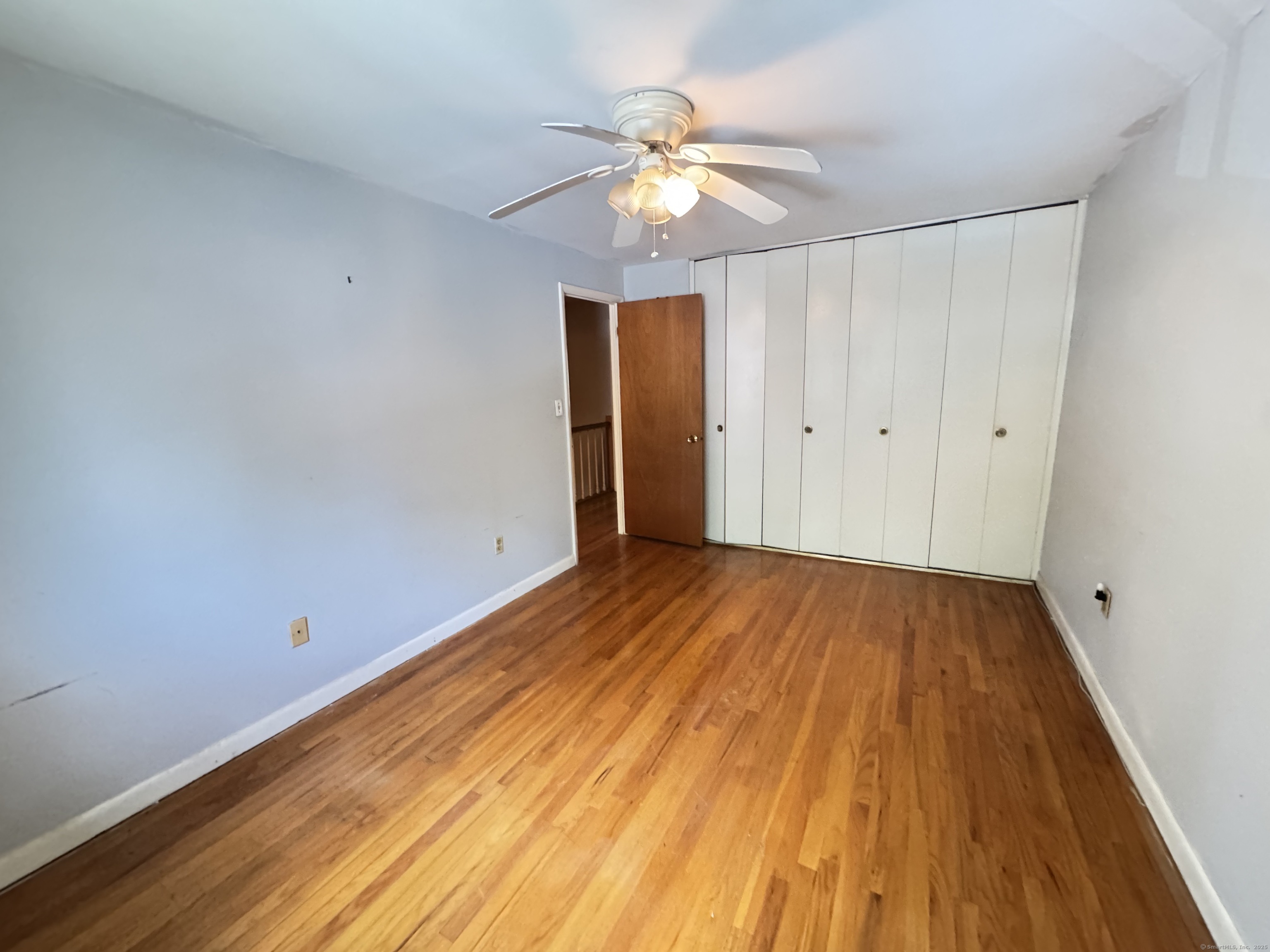 141 Worth Avenue Hamden, CT 06518 - Photo 10 of 17 wooden floor in an empty room