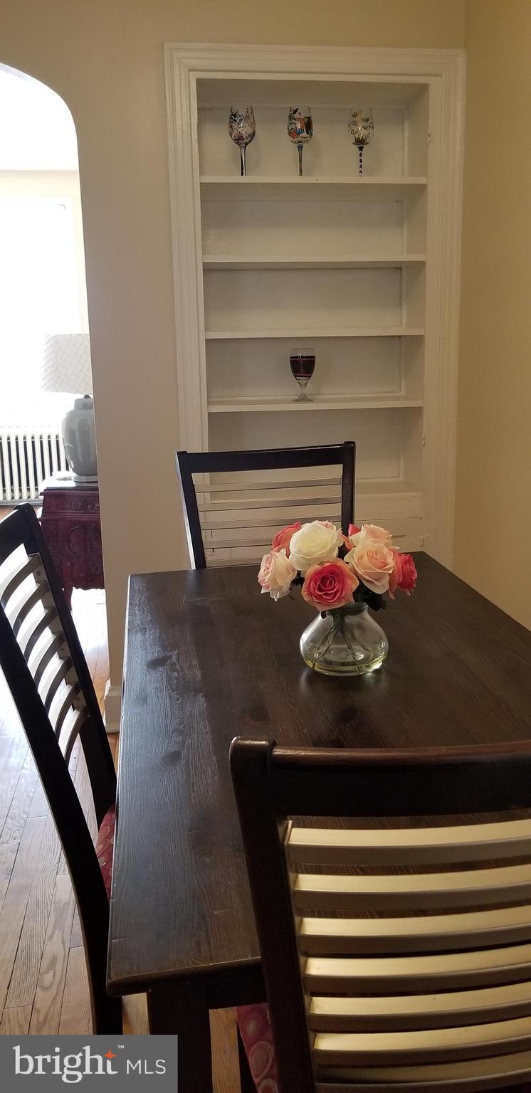 2821 7th Street Northeast Washington, DC 20017 - Photo 4 of 7 a view of a dining room with furniture and a potted plant