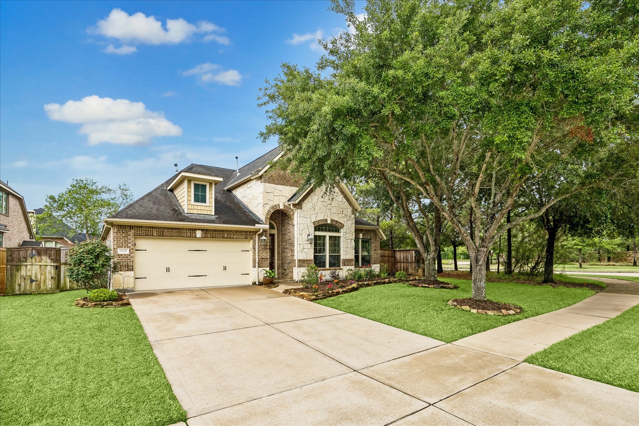28211 Rippling Brook Lane Fulshear, TX 77441 - Photo 34 of 45 a front view of a house with a yard