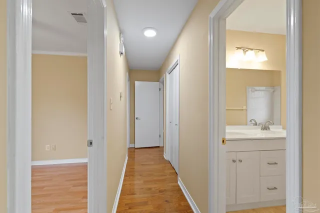 a view of a bathroom from a hallway
