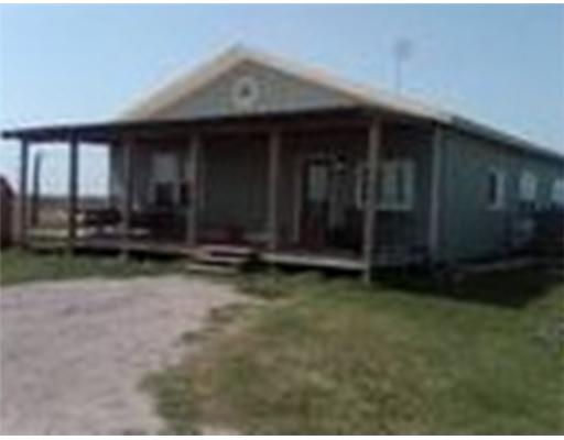 a view of backyard with large trees