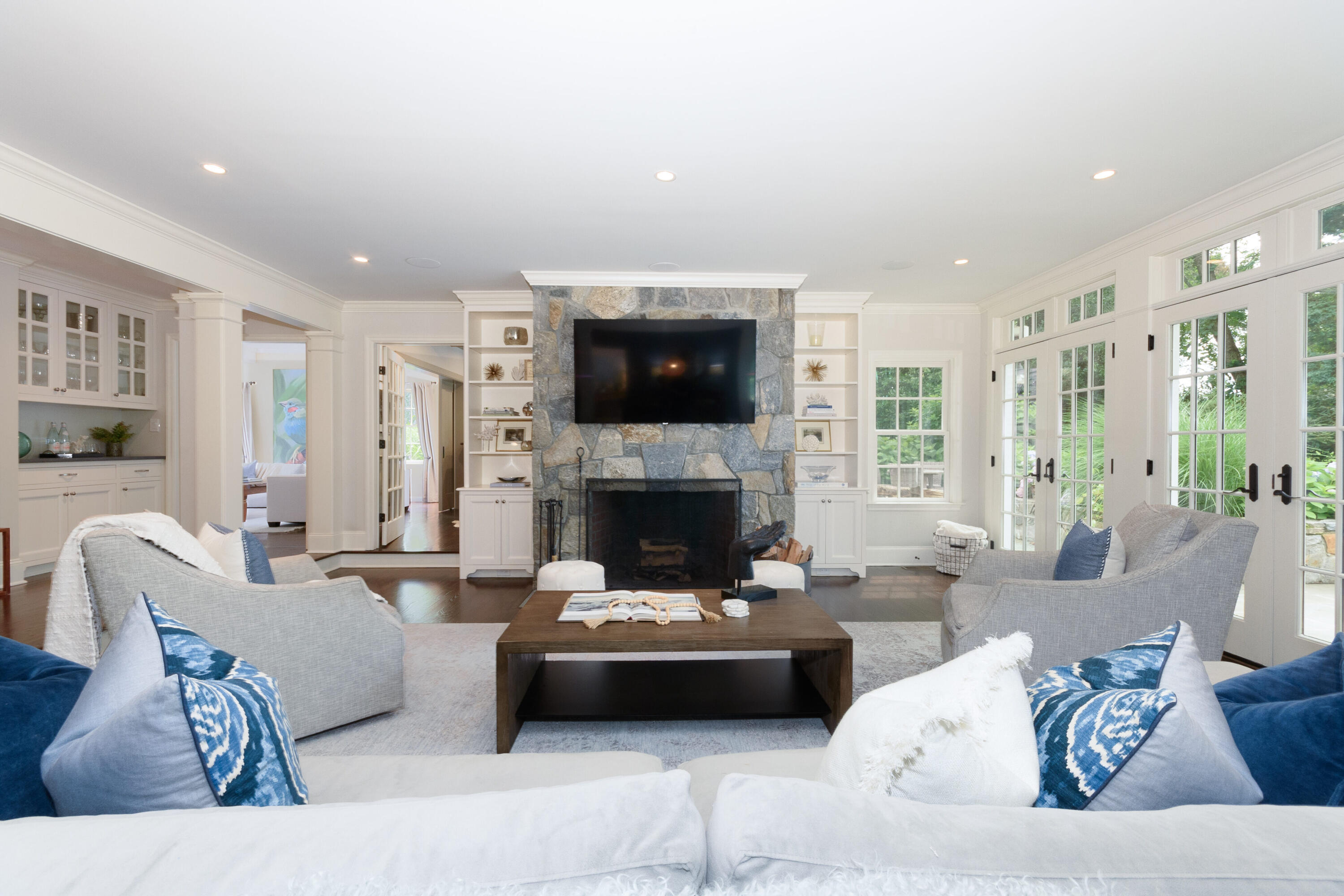 48 Long Neck Point Road Darien, CT 06820 - Photo 14 of 46 a living room with furniture and a fireplace