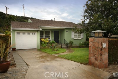 1852 Alpha Road Glendale, CA 91208 - Photo 1 of 13 a front view of a house with garden