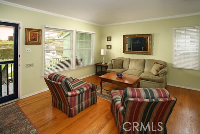 1852 Alpha Road Glendale, CA 91208 - Photo 3 of 13 a living room with furniture and a floor to ceiling window