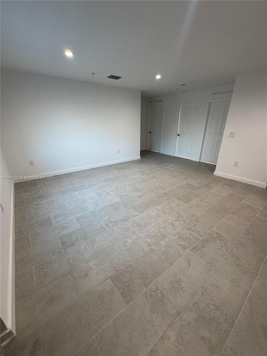 2782 Northwest 46th Street, Unit 5 Miami, FL 33142 - Photo 11 of 18 a view of an empty room