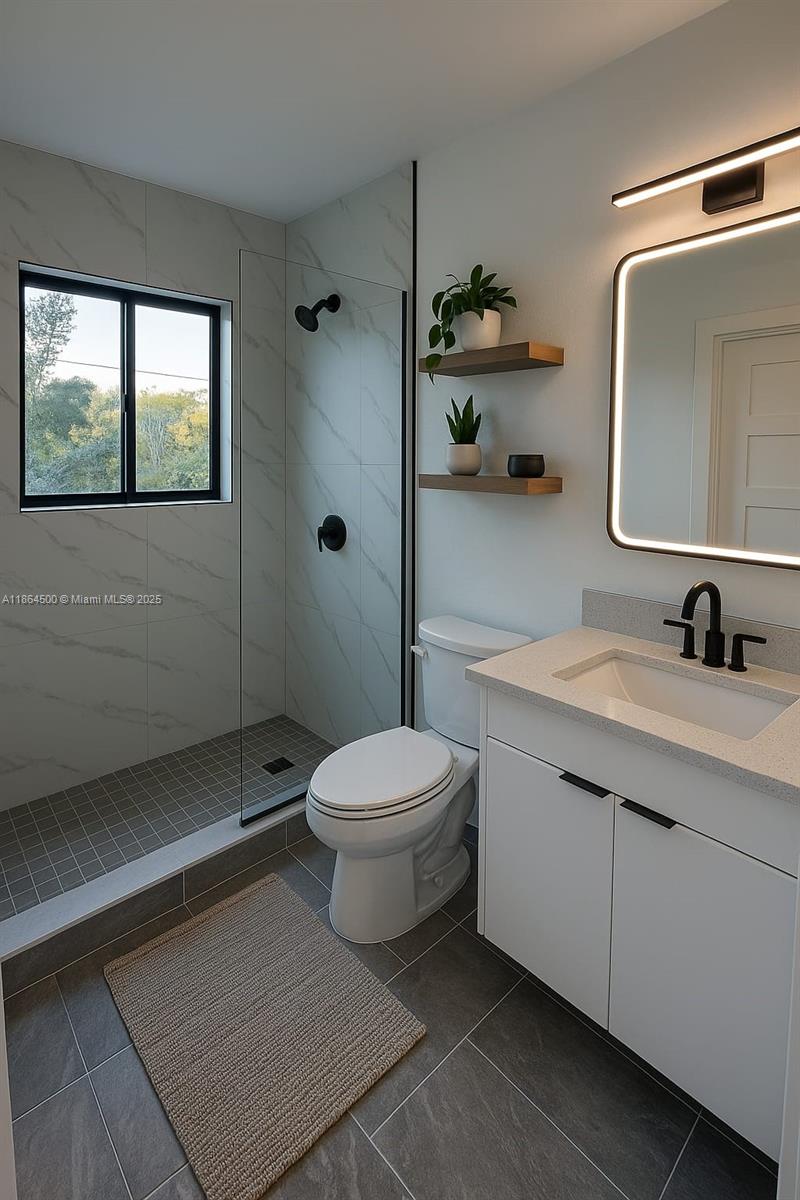 2782 Northwest 46th Street, Unit 5 Miami, FL 33142 - Photo 9 of 18 a bathroom with a toilet a sink and mirror