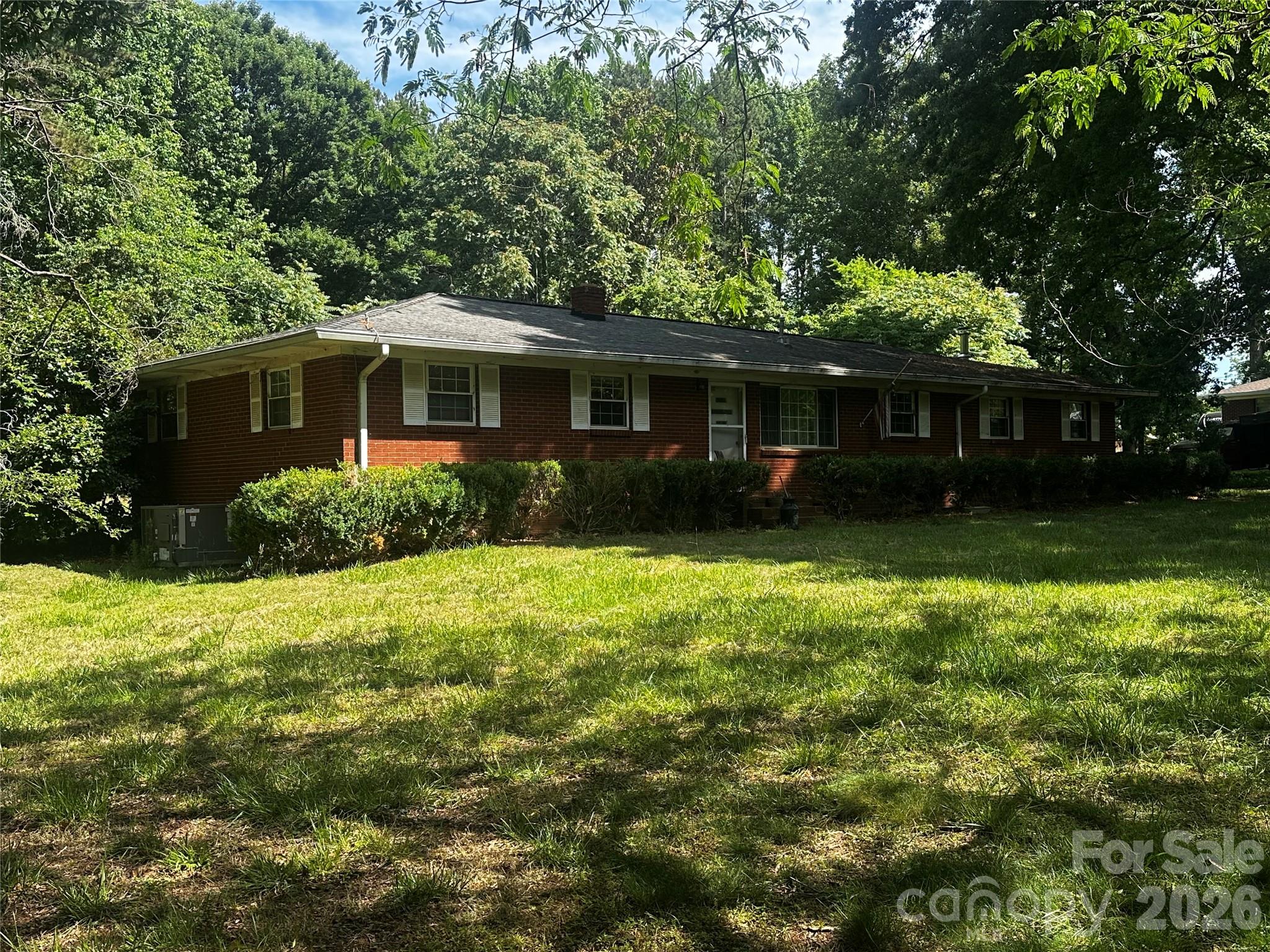 15023 Thompson Road Mint Hill, NC 28227 - Photo 1 of 3 a front view of a house with garden