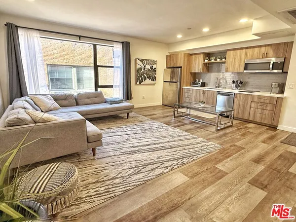 a living room with furniture and a table