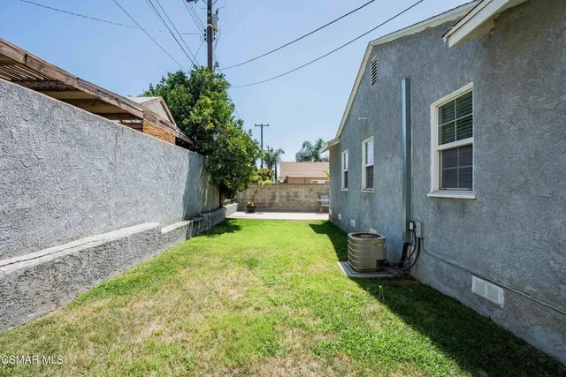 a backyard of a house with lots of green space