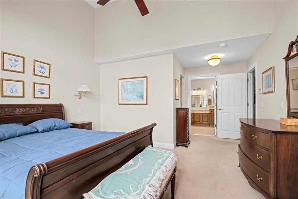 7 Primmett Lane, Unit 7 Worcester, MA 01609 - Photo 16 of 38 a bedroom with furniture and wooden floor