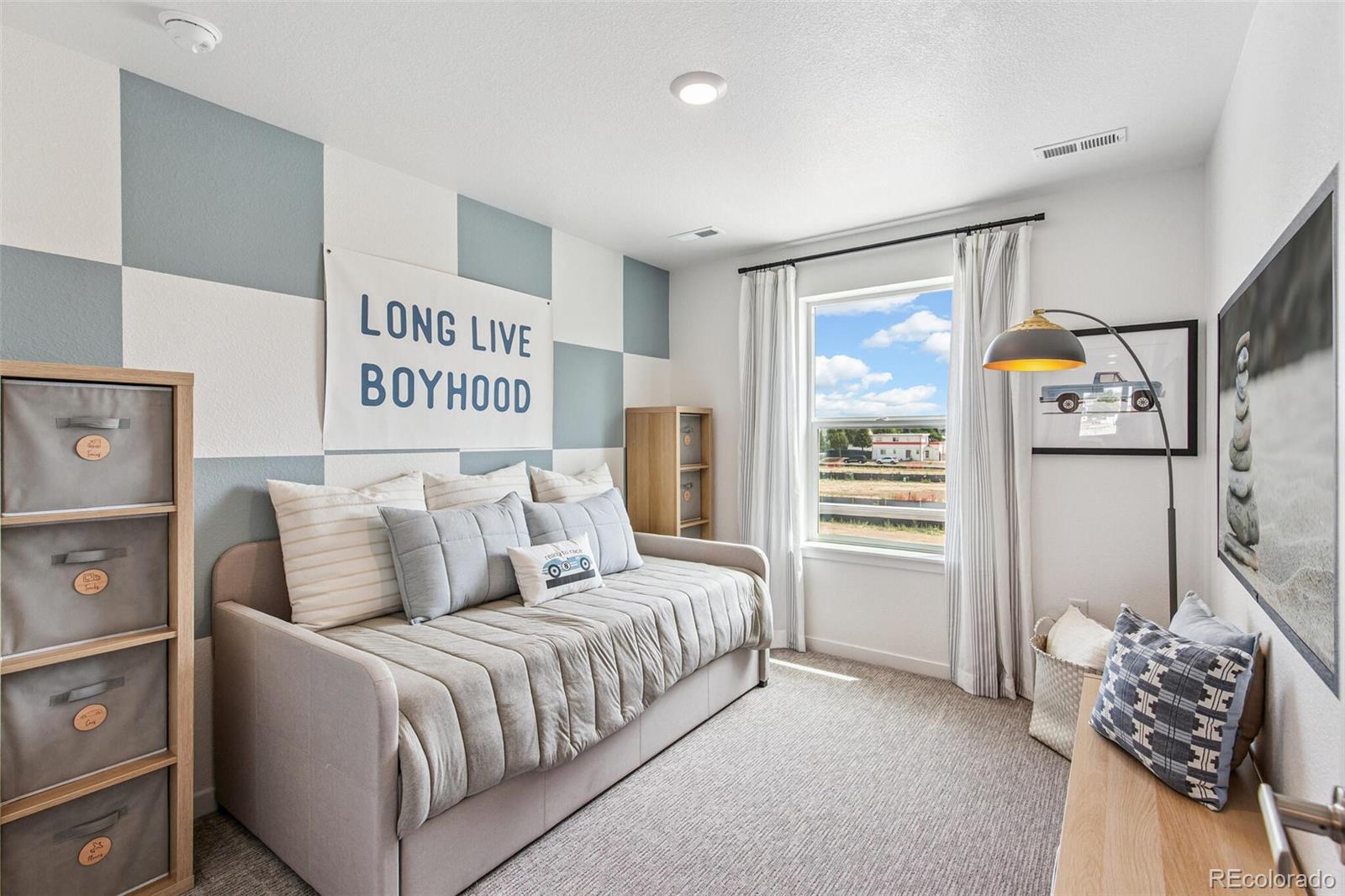 1373 South Chester Street, Unit A Denver, CO 80247 - Photo 26 of 28 a bedroom with a bed and a window