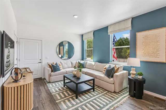a living room with furniture rug and window