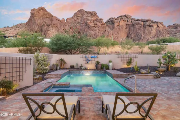 an aerial view of a house with yard swimming pool and outdoor seating