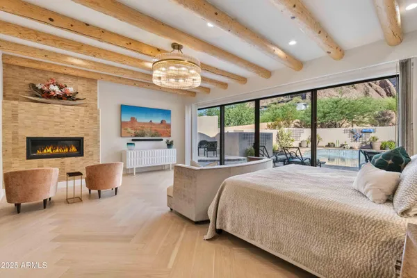 a living room with furniture and a floor to ceiling window
