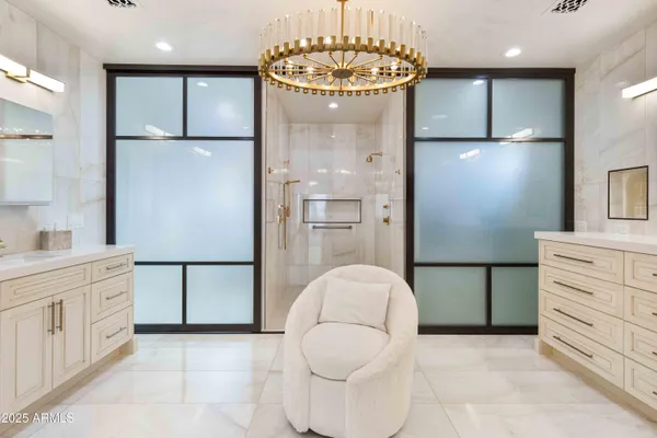 a dining room with furniture water view and a floor to ceiling window
