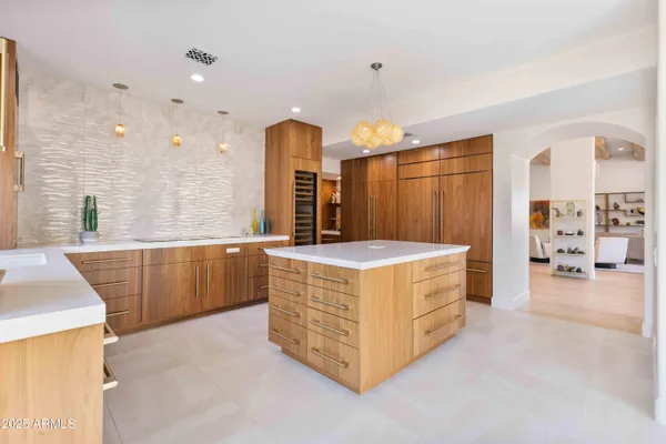 a view of a refrigerator in kitchen and wooden floor