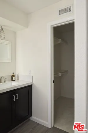 a bedroom with bed and a window
