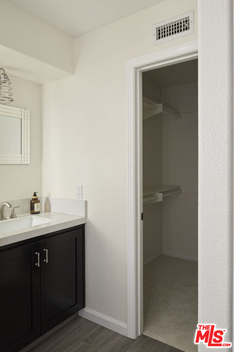 13230 Creekside Lane Poway, CA 92064 - Photo 13 of 23 a bathroom with a sink and mirror