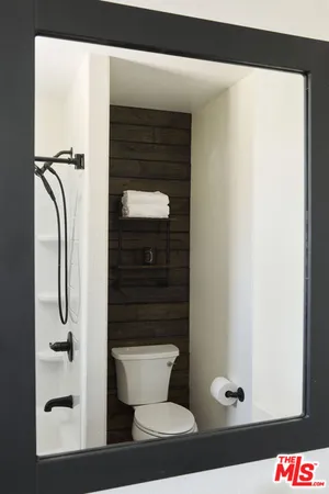 a room with a table and a mirror