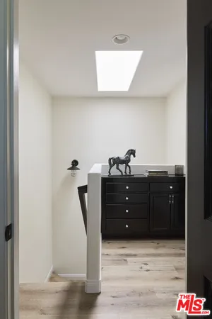 en empty room with ceiling fan and window