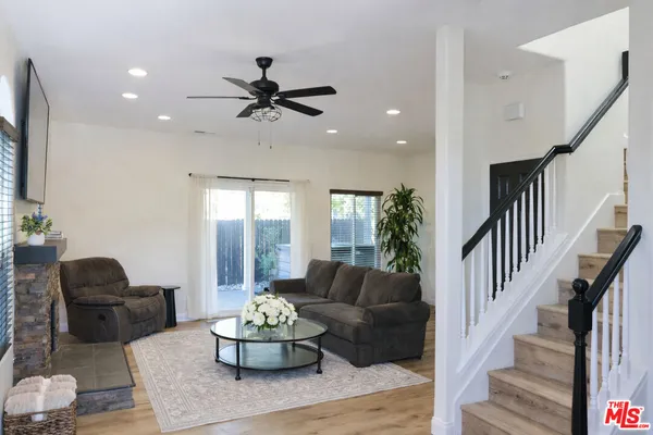 a room with furniture a chandelier and a window