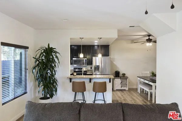 a view of a chairs and table in a microwave