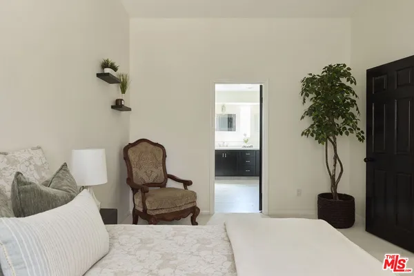 a bathroom with a double vanity sink and mirror