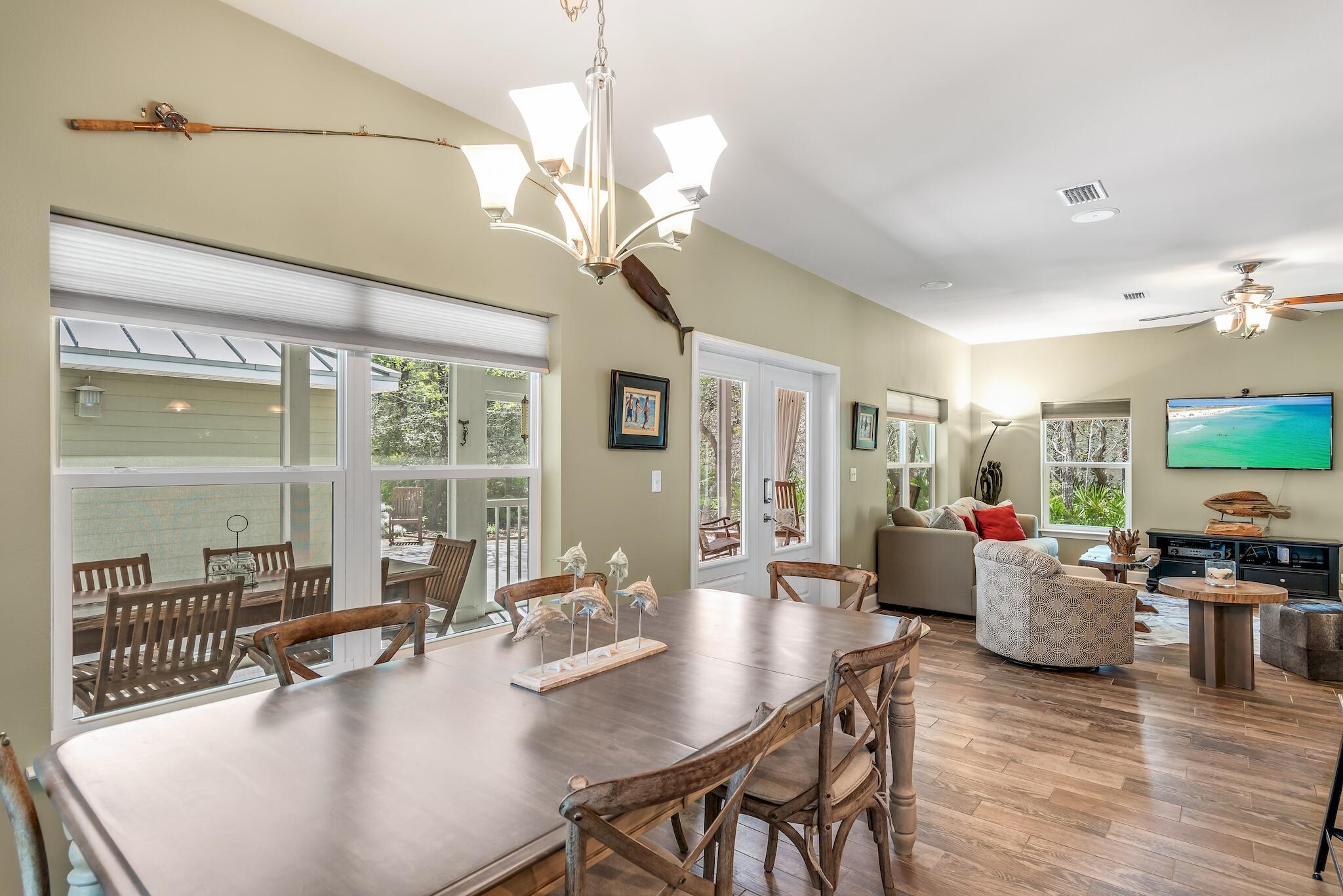160 Spotted Dolphin Road Santa Rosa Beach, FL 32459 - Photo 21 of 38 a living room with fireplace furniture and a chandelier