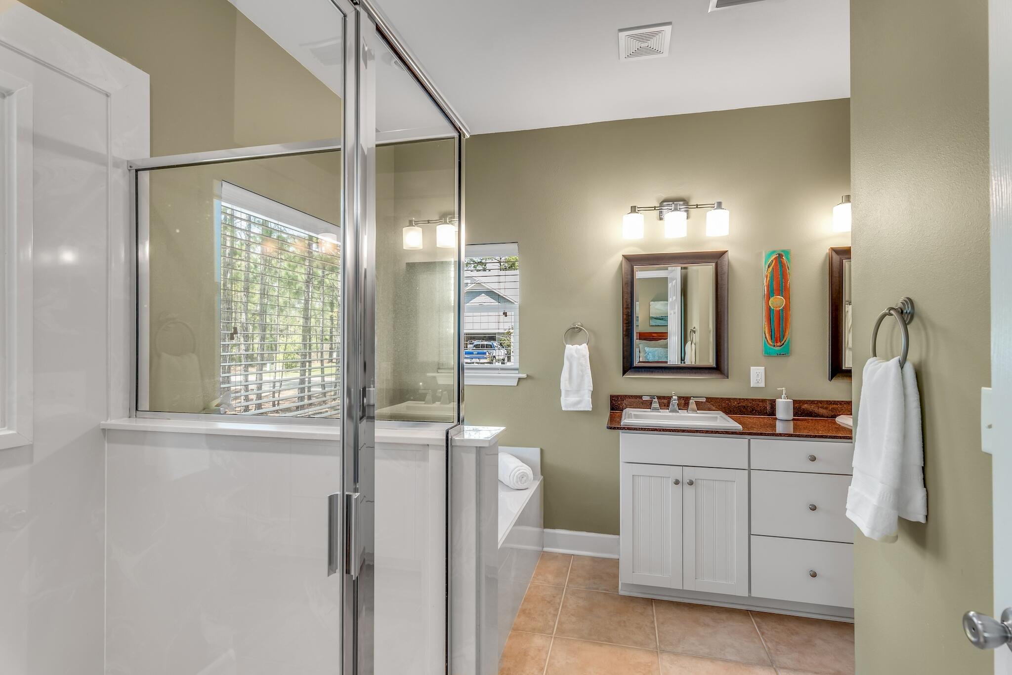 160 Spotted Dolphin Road Santa Rosa Beach, FL 32459 - Photo 24 of 38 a bathroom with a double vanity sink mirror and shower