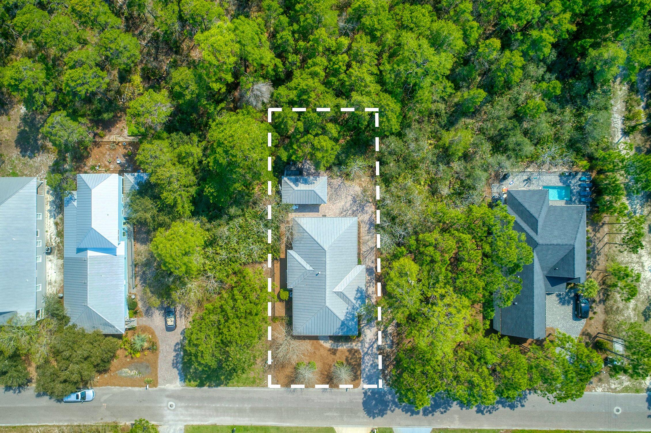 160 Spotted Dolphin Road Santa Rosa Beach, FL 32459 - Photo 4 of 38 an aerial view of a house with trees