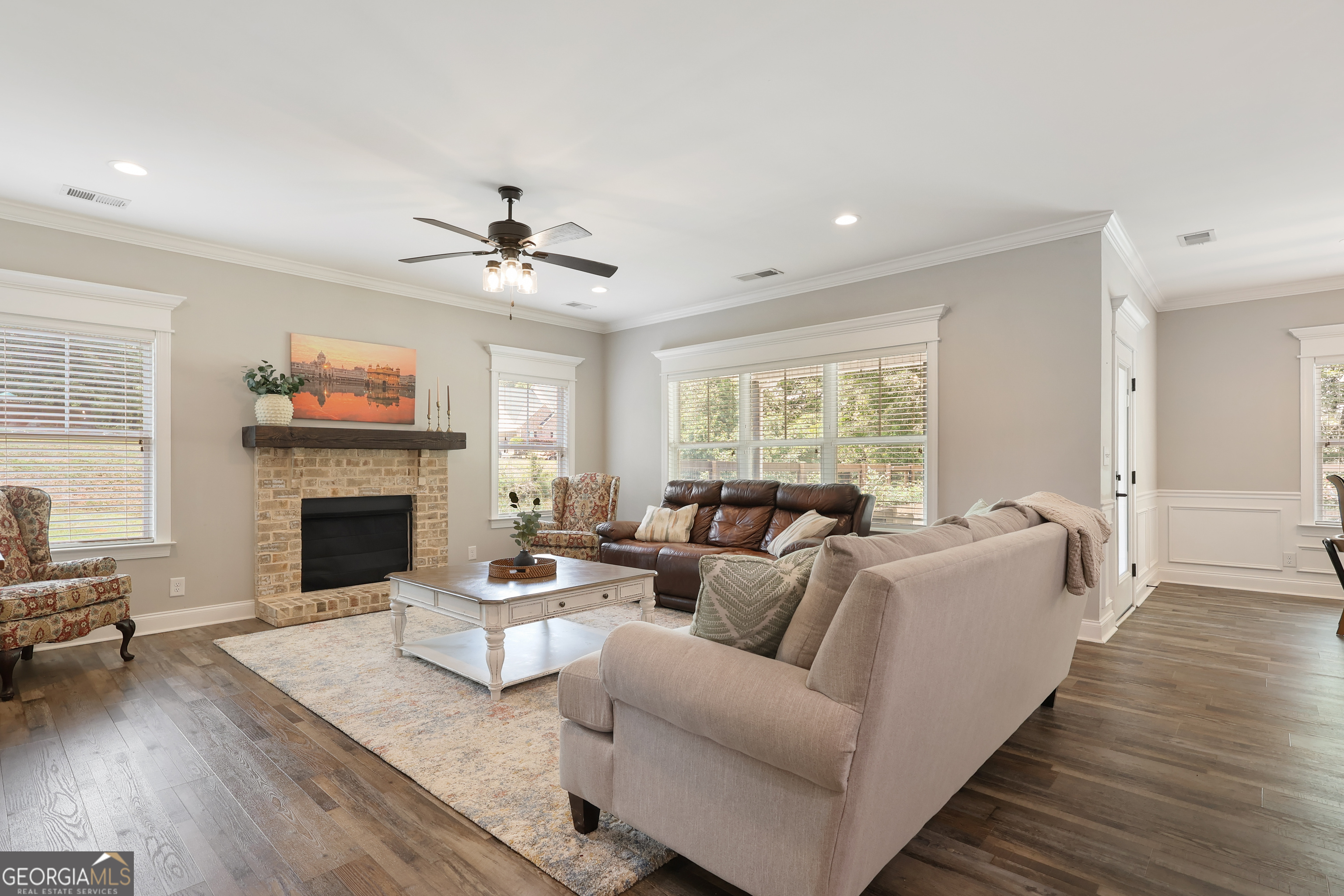 89 Claire Road Forsyth, GA 31029 - Photo 11 of 40 a living room with furniture a fireplace and a large window