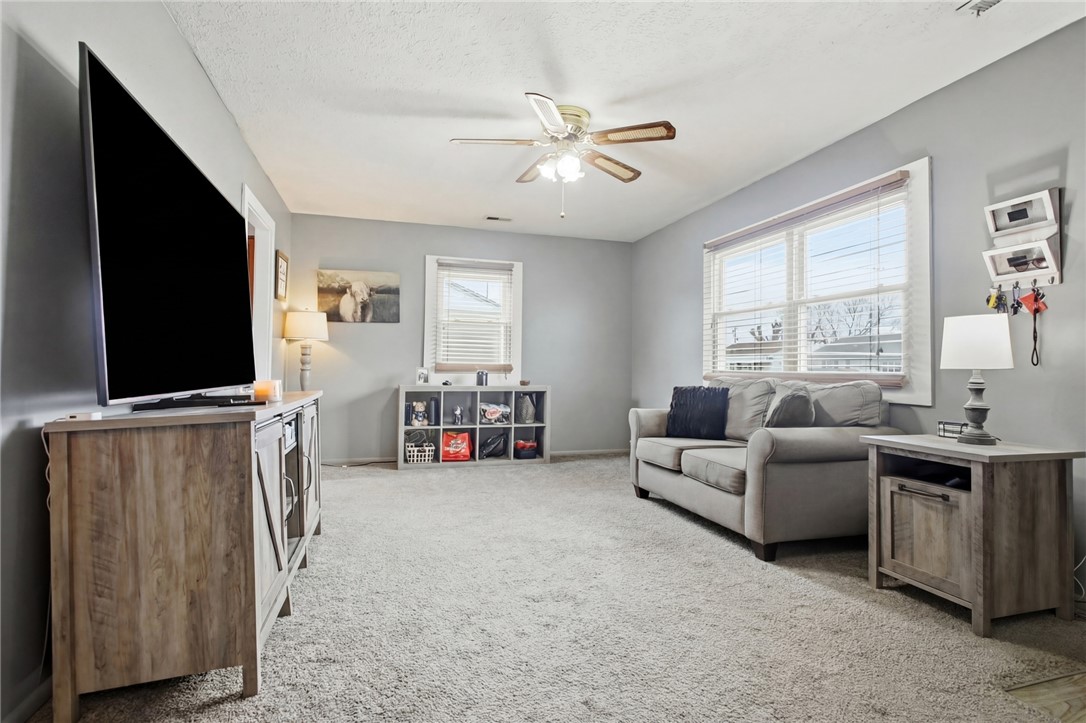 2745 Share Street Springfield, OH 45505 - Photo 5 of 28 This inviting living room offers comfort and ample natural light, creating a perfect gathering space.