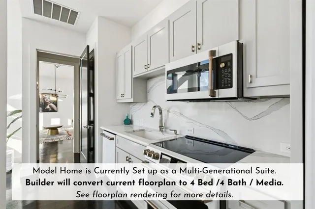 a view of a kitchen with kitchen island granite countertop a sink stainless steel appliances and cabinets
